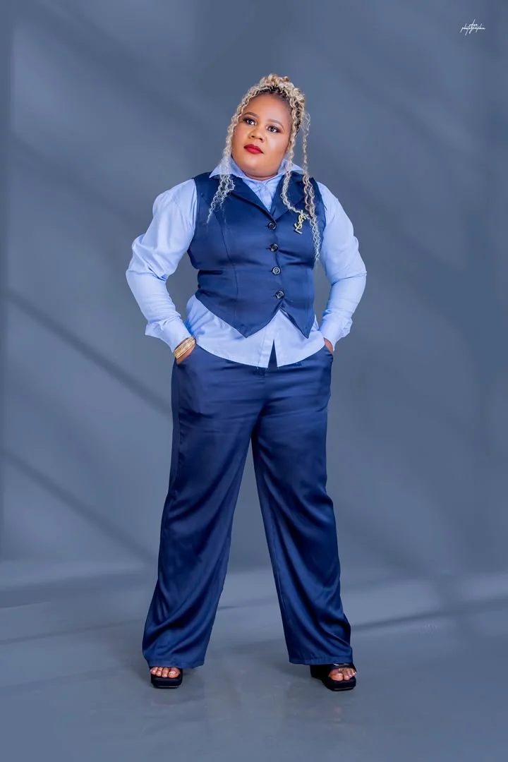Founder and CEO of Chichi The Event Planner standing in a navy blue suit